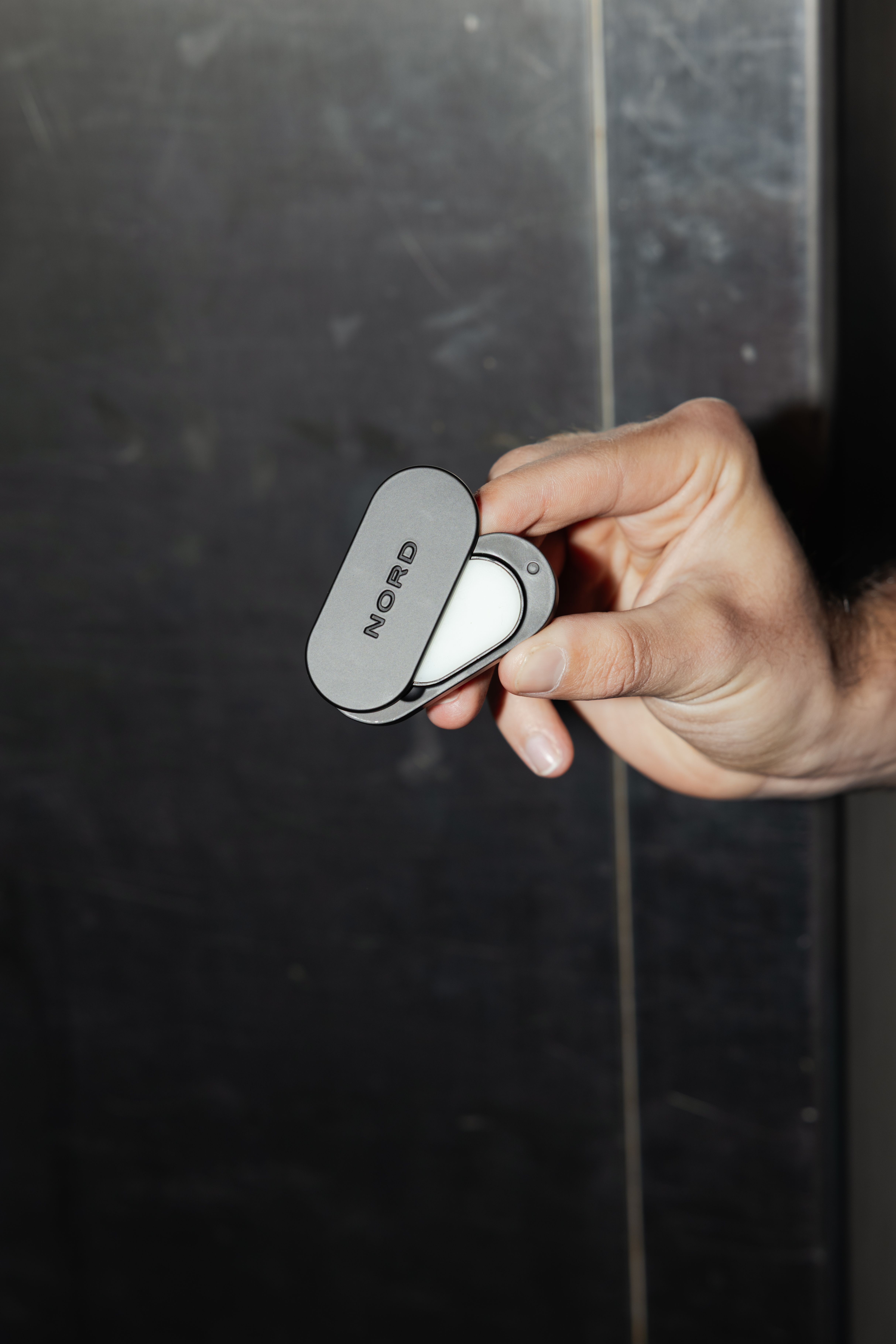 Person holding the Nord Solid Perfume Case